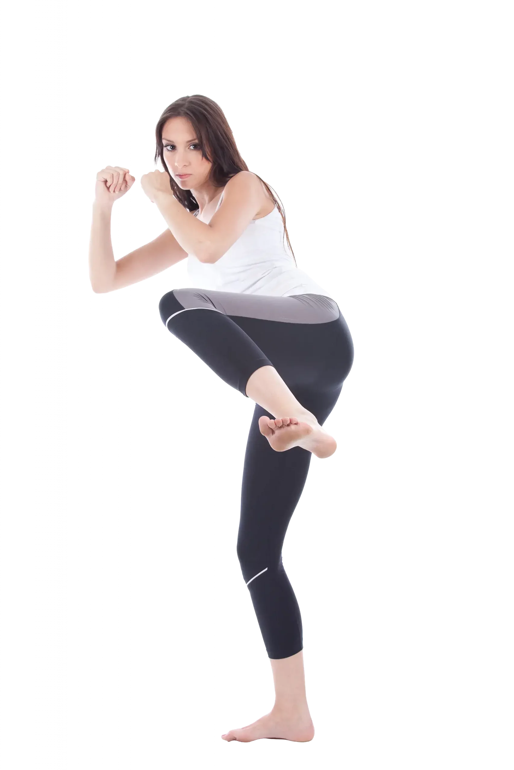 Kampfkunstschule Korean Fighters Werl - Selbstverteidigung für Frauen - Frau in Kickpose Selbstverteidigung für Frauen: Sportlerin in Kampfstellung mit Deckung, hebt das Knie zum Kick an (Frontkick-Position) und zeigt eine stabile, sichere Abwehrhaltung